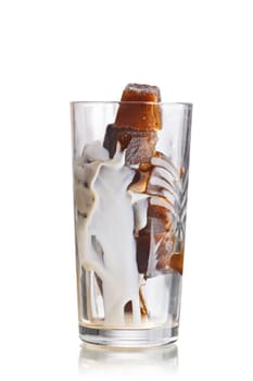 Milk coffee cocktail from frozen coffee cubes in highball glass. Iced milk coffee