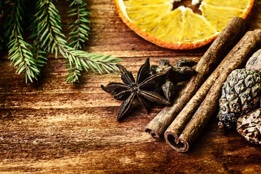 Collection of spices for mulled wine on wooden table