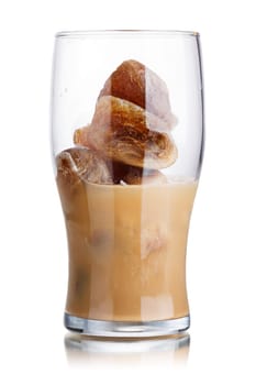 Milk coffee cocktail from frozen coffee cubes in highball glass. Iced milk coffee