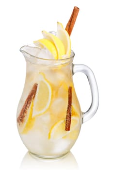 Jug of lemon cinnamon sparkling lemonade (spritzer). Carbonated iced water with lemon and cinnamon sticks in a glass pitcher
