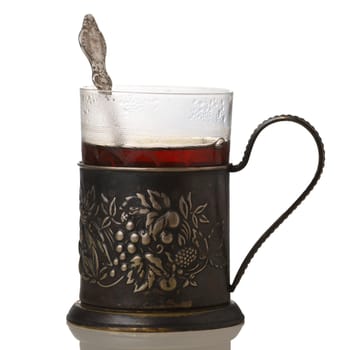 Glass of tea in vintage glass-holder (podstakannik)
