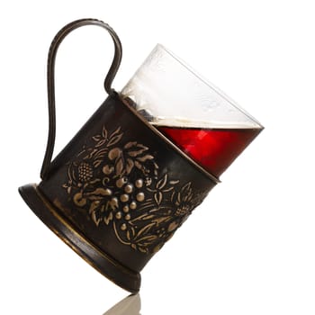 Glass of tea in vintage glass-holder (podstakannik)