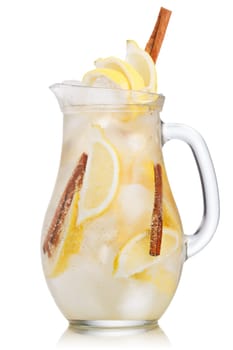 Jug of lemon cinnamon sparkling lemonade (spritzer). Carbonated iced water with lemon and cinnamon sticks in a glass pitcher