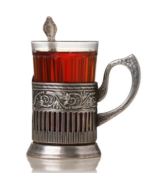 Glass of tea in vintage glass-holder (podstakannik)