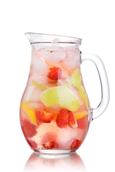Glass jug of iced detox water with strawberry, apple and lemon
