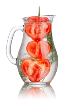 Pitcher of detox water with heart shaped tomato and fresh dill. Jug full of tomato dill infused water. Healthy,clean eating concept