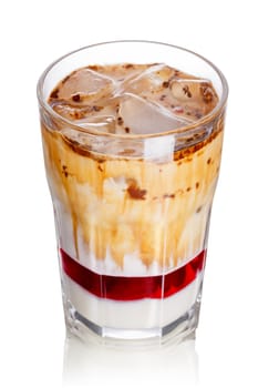 Layered iced milkshake with strawberry syrup, condensed milk and chocolate. Delicious milk cocktail in highball glass
