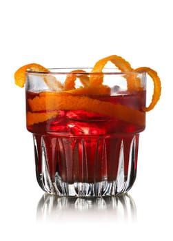 Negroni alcoholic cocktail decorated with orange twist. Before dinner official IBA cocktail
