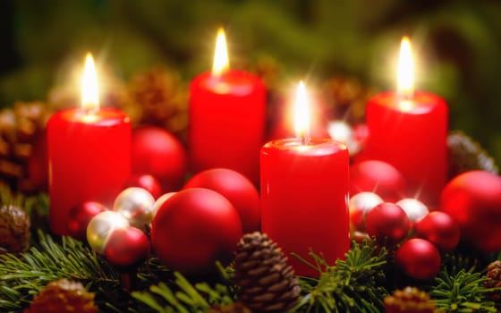 Studio shot of a nice advent wreath with baubles and four burning red candles