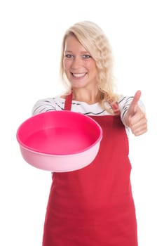 Woman in apron holds a silicone mold and shows thumbs up