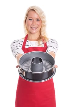 Housewife in apron shows a baking dish made of sheet metal