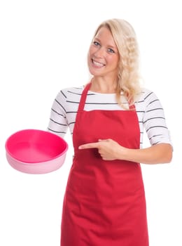 Housewife in apron points to a silicone baking mold