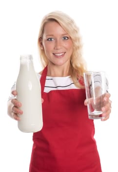Blonde woman in apron offers whole milk in a glass bottle