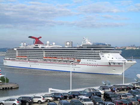 NEW YORK, NEW YORK - June 15, 2012 - The Carnival Miracle sailing alongside New York, New York.