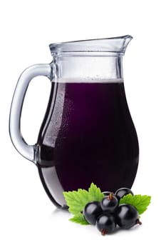 Fresh blackcurrant juice in a pitcher. Full jug of black currant drink.