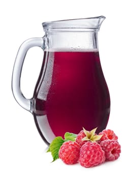 Raspberry juice in a misted pitcher. Full jug of raspberry drink.