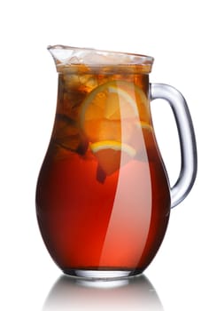 Iced tea in a pitcher. Jug full of fresh lemon tea served with ice.