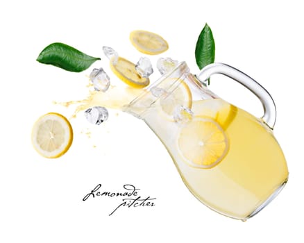 Falling down lemonade pitcher with splashes,lemon slices and ice cubes. Jug of lemonade in action