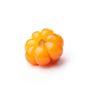 Single cloudberry (moroshka) isolated on white. Wild northern berry. Large depth of field