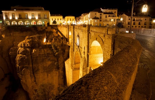 Illuminated bridge from old town of Ronda, Spain. Night scene