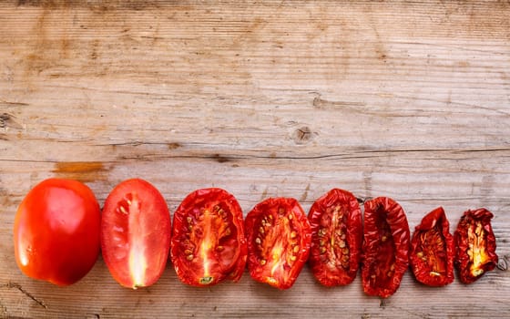 Sequential stages of tomato drying from fully fresh to almost dehydrated