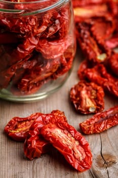 Sun dried tomatoes on  wooden table.Selective focus