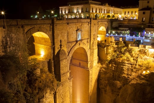 Illuminated bridge from old town of Ronda, Spain. Night scene