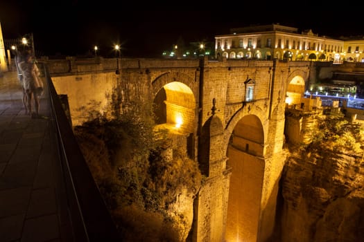 Illuminated bridge from old town of Ronda, Spain. Night scene