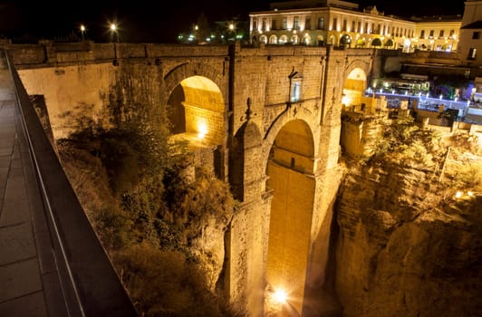 Illuminated bridge from old town of Ronda, Spain. Night scene