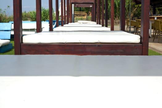 Lounger beds on beach relaxing resort, south of Spain
