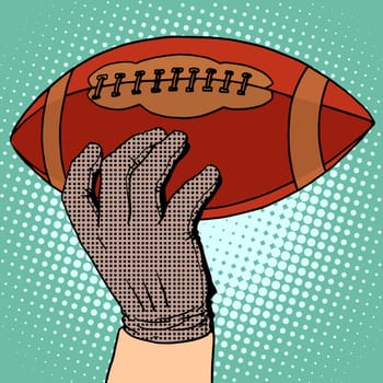 The ball of American football in his hand pop art retro style. Sports and Hobbies
