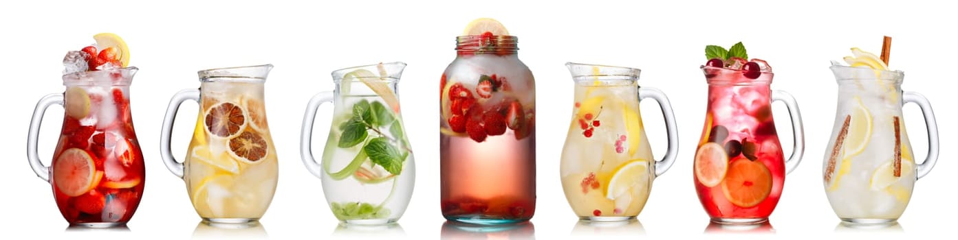 Collection of different drinks in glass jugs and jars. Glasses full of spritzers, schorle,lemonade,iced tea, detox waters. Healthy eating