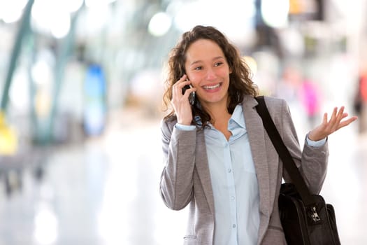 View of a Young attractive business woman using smartphone