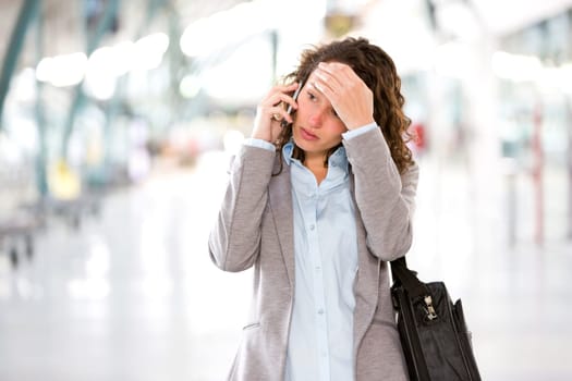 View of a Young attractive business woman using smartphone