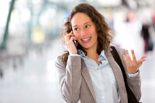 View of a Young attractive business woman using smartphone