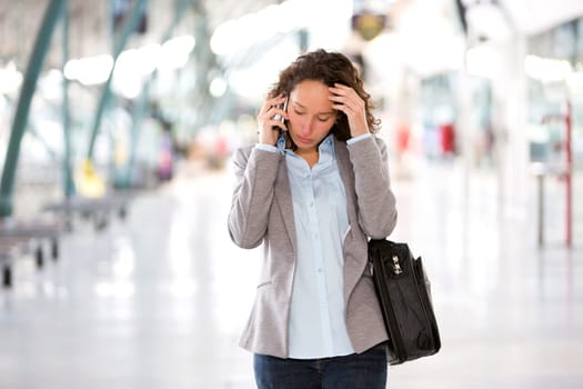 View of a Young attractive business woman using smartphone