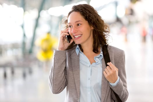 View of a Young attractive business woman using smartphone