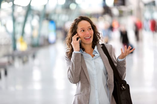 View of a Young attractive business woman using smartphone
