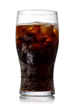 Malta soda (soft drink) in a glass with ice. Lightly carbonated malt beverage, brewed from barley and hops. Also known as Malzbier, malztrunk,kinderbier.