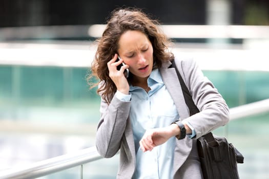 View of a Young attractive woman being late to a rendez-vous