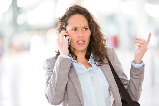 View of a Young attractive business woman using smartphone