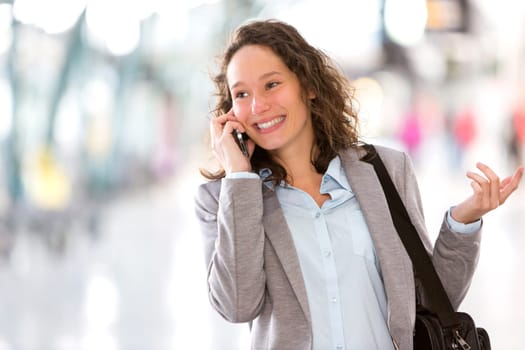 View of a Young attractive business woman using smartphone