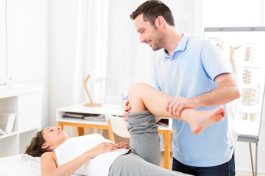 View of a Young attractive woman being manipulated by physiotherapist