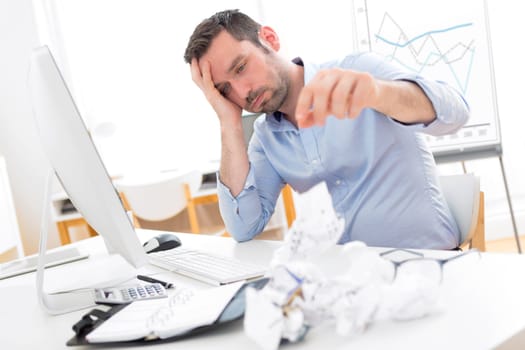View of a Young attractive man too tired to work