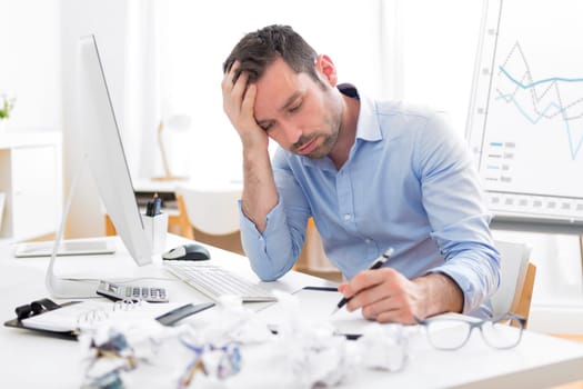 View of a Young attractive man too tired to work