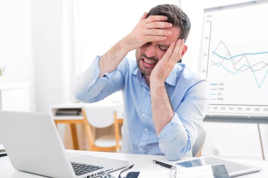 View of a Young attractive business feeling pain because of burn out