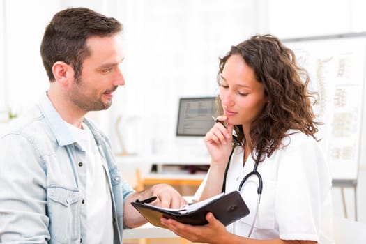View of a Young attractive doctor dating next appointment