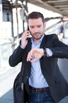 View of a Young attractive man being late to an appointment