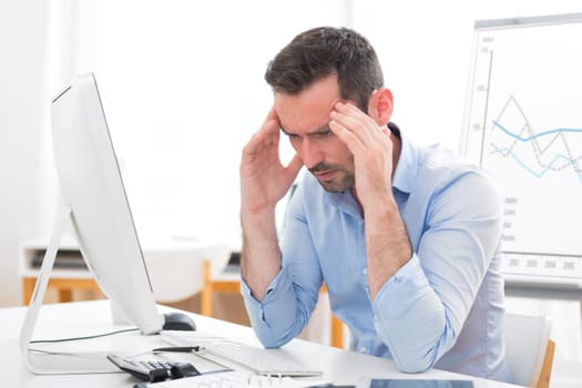View of a Young attractive business got headache because of burn out
