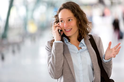 View of a Young attractive business woman using smartphone